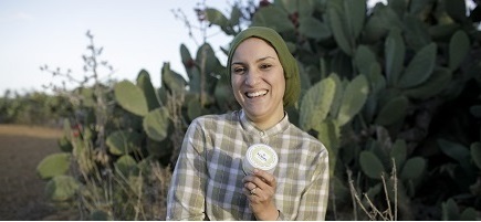 A woman in front of cacti
