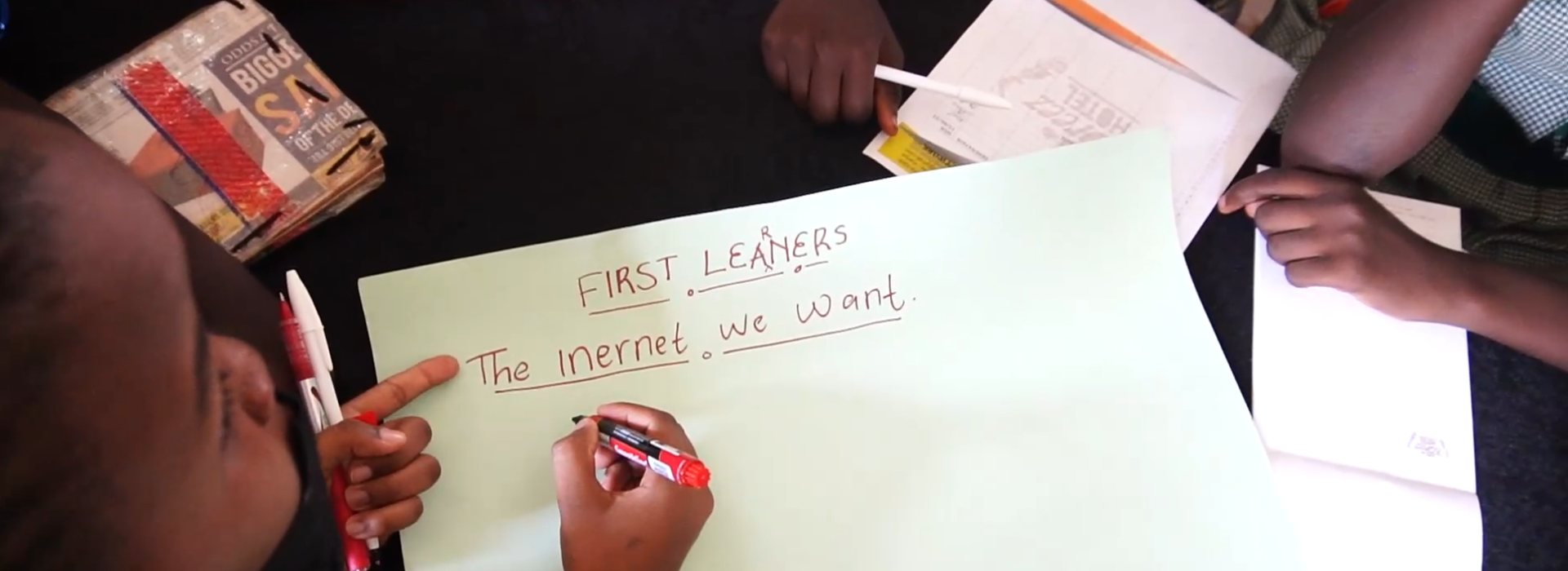 Children describe a poster with the heading ‘The internet we want’.